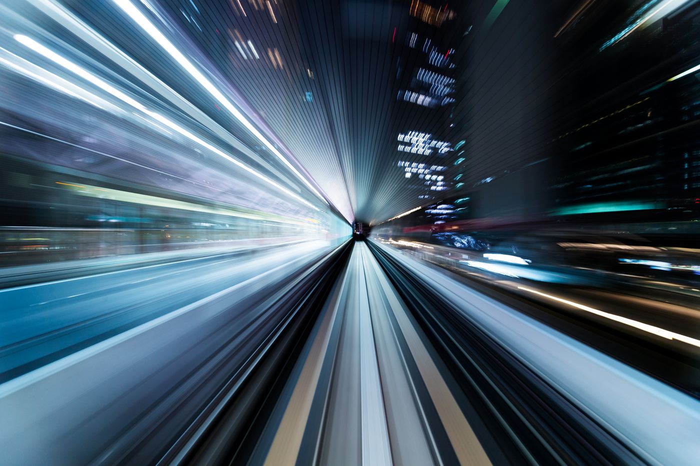 Light trails rushing through a tunnel at speed